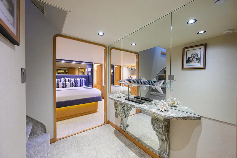 Hard Times Yacht Photos Pics Luxurious interior of 1998 Westport Westbay Sonship yacht with elegant bedroom and decorative accents.