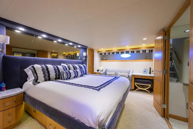 Hard Times Yacht Photos Pics Luxurious bedroom in 1998 Westport Westbay Sonship yacht with elegant decor and modern amenities.