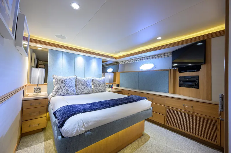 Hard Times Yacht Photos Pics Luxurious bedroom in 1998 Westport Westbay Sonship yacht with modern decor and ambient lighting.