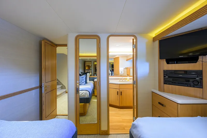 Hard Times Yacht Photos Pics Luxurious 1998 Westport Westbay Sonship yacht interior with twin beds and modern amenities.
