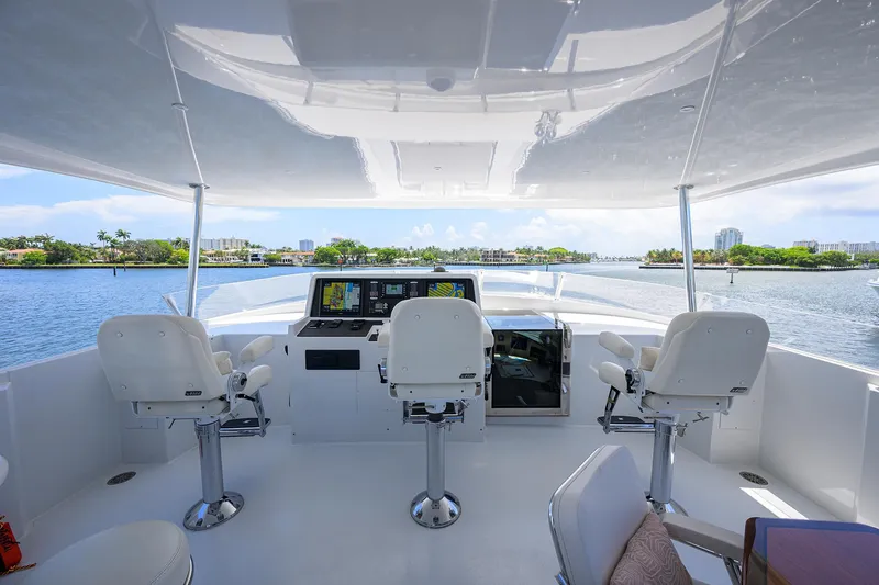 Hard Times Yacht Photos Pics Raised pilothouse of 1998 Westport Westbay Sonship yacht with white seating and navigation equipment.