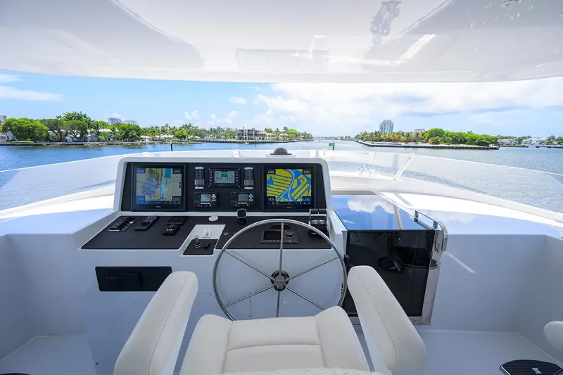 Hard Times Yacht Photos Pics Raised pilothouse of 1998 Westport Westbay Sonship yacht with navigation screens and steering wheel.