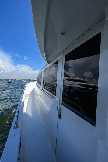 Hard Times Yacht Photos Pics 1998 Westport Westbay Sonship Raised Pilothouse yacht, side view, on open water under blue sky.