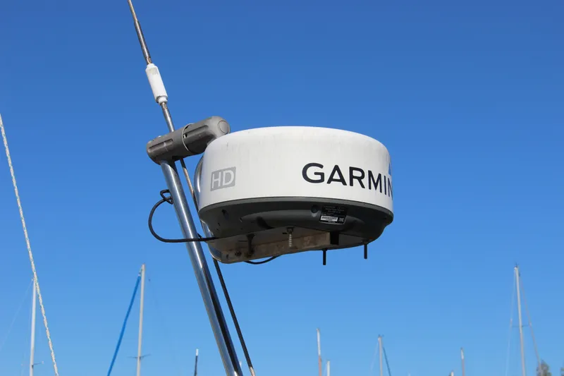 Manu Wai Yacht Photos Pics Garmin radar on a 1988 Cape George 38 sailboat against a clear blue sky.