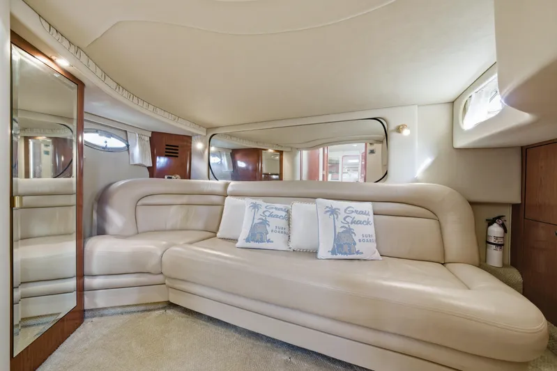 Life Is Good Yacht Photos Pics Luxurious interior of 2002 Sea Ray 460 Sundancer yacht with plush seating and decorative pillows.