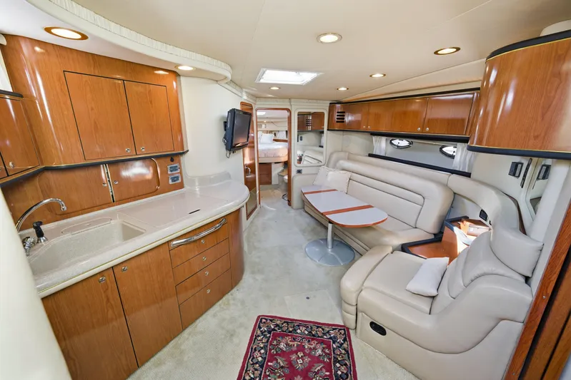 Life Is Good Yacht Photos Pics Luxurious interior of 2002 Sea Ray 460 Sundancer yacht with elegant wood cabinetry.