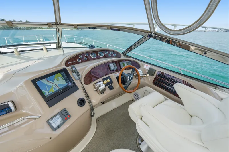 Life Is Good Yacht Photos Pics Helm of 2002 Sea Ray 460 Sundancer yacht with navigation equipment and steering wheel.