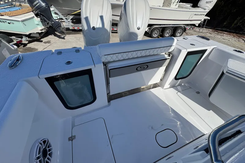  Yacht Photos Pics 2026 Sportsman Open 262 Center Console boat interior with seating and storage compartments.