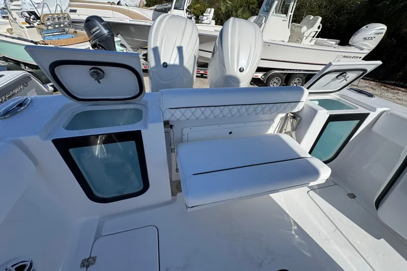  Yacht Photos Pics 2026 Sportsman Open 262 Center Console boat interior with seating and storage compartments.