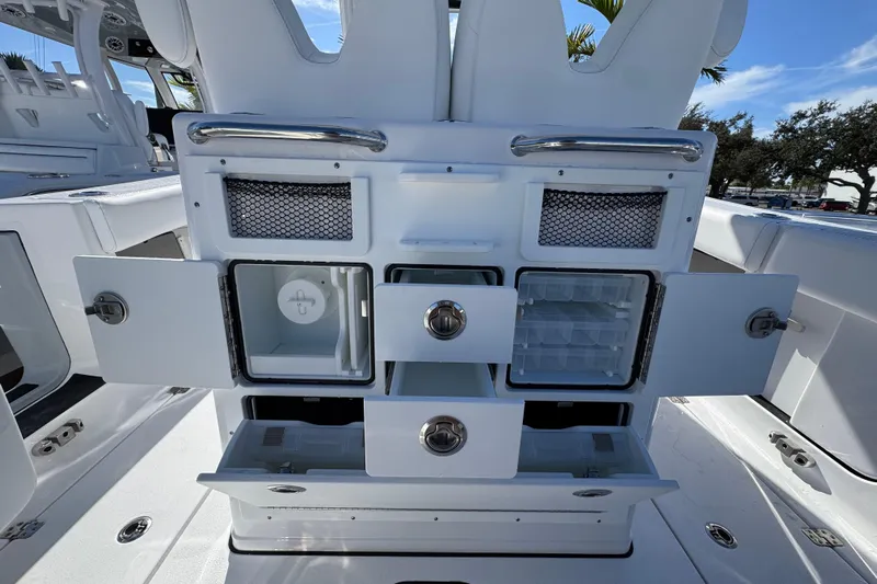  Yacht Photos Pics 2026 Sportsman Open 262 Center Console boat interior with open storage compartments and drawers.