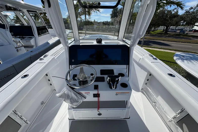  Yacht Photos Pics 2026 Sportsman Open 262 Center Console boat interior with steering wheel and control panel.