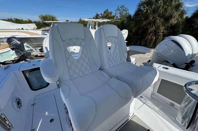  Yacht Photos Pics 2026 Sportsman Open 262 Center Console boat with luxurious white seating.