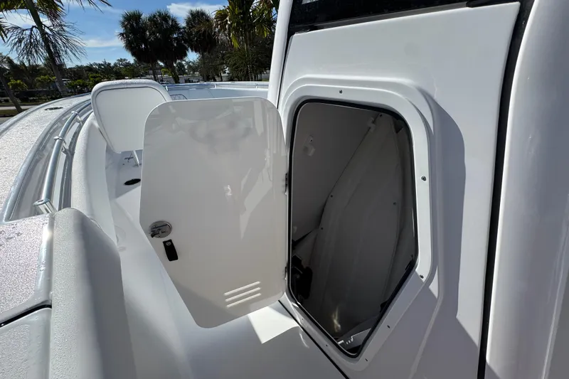 Yacht Photos Pics 2026 Sportsman Open 262 Center Console boat with open storage compartment.