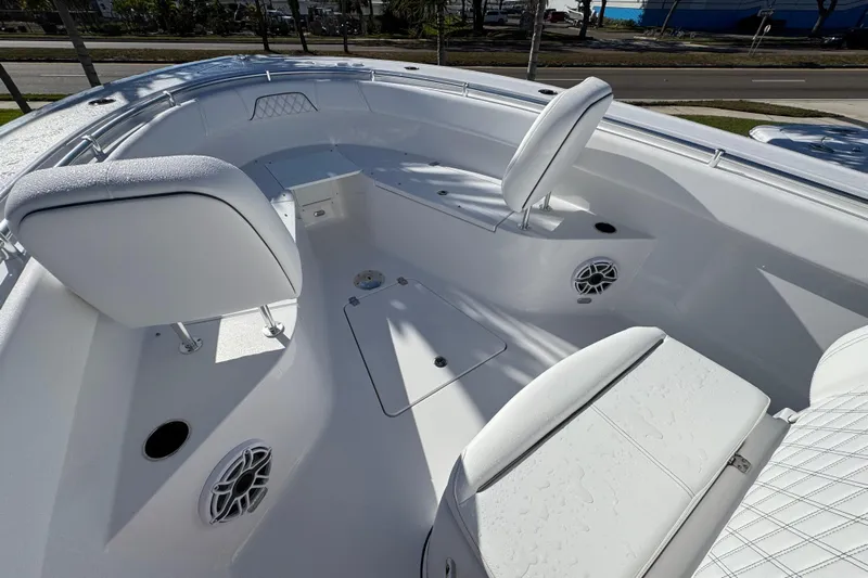  Yacht Photos Pics 2026 Sportsman Open 262 Center Console boat interior with white seating and speakers.