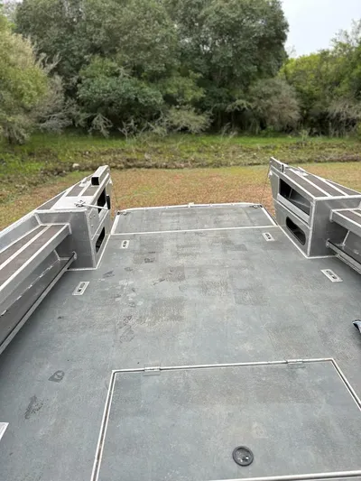 Commander Yacht Photos Pics 2014 Wooldridge 31 boat deck with forest background.