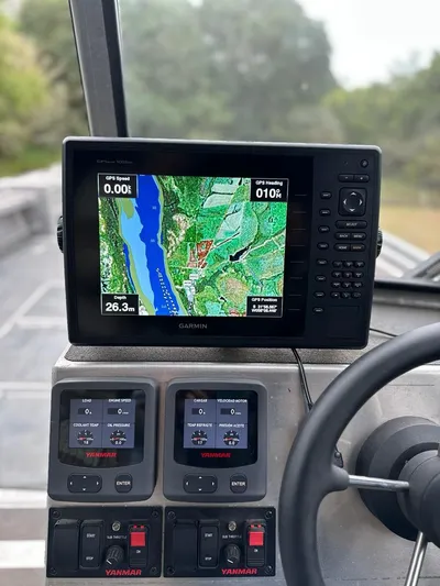 Commander Yacht Photos Pics Garmin GPS navigation system on a 2014 Wooldridge 31 boat dashboard.