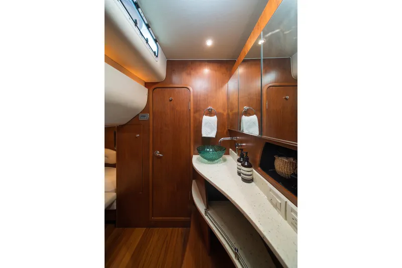  Yacht Photos Pics Luxurious 2007 Tiara Yachts 4300 Sovran bathroom with wood accents and modern fixtures.