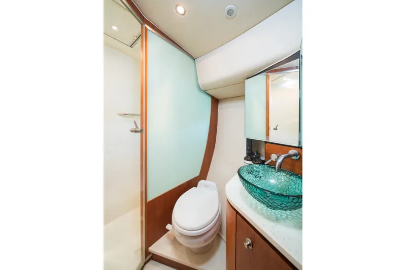  Yacht Photos Pics Luxurious 2007 Tiara Yachts 4300 Sovran bathroom with glass sink and modern fixtures.