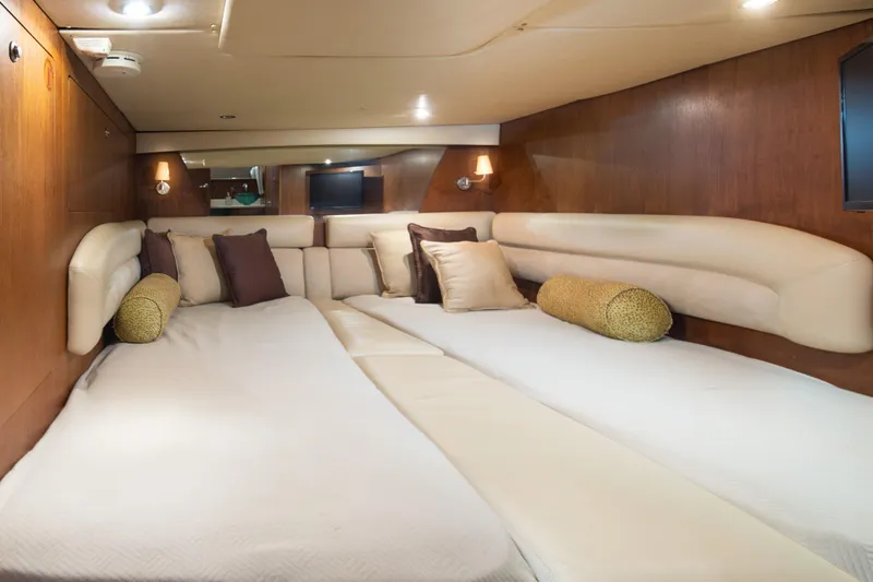  Yacht Photos Pics Luxurious cabin interior of 2007 Tiara Yachts 4300 Sovran with plush bedding and elegant lighting.