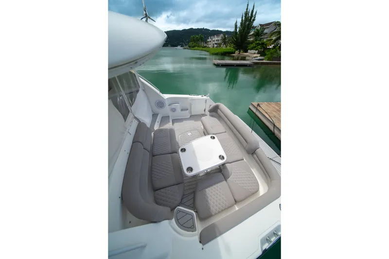  Yacht Photos Pics Luxurious seating area on a 2007 Tiara Yachts 4300 Sovran, docked by serene waters.
