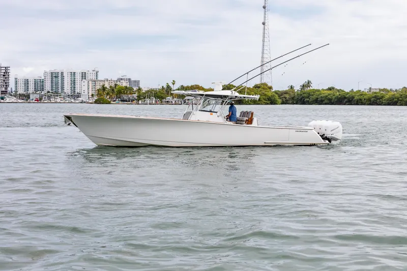 Bank Fees Yacht Photos Pics 2022 Valhalla Boatworks V-41 cruising on water near city skyline.