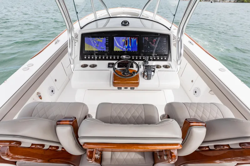 Bank Fees Yacht Photos Pics 2022 Valhalla Boatworks V-41 helm with advanced navigation displays and luxurious seating.