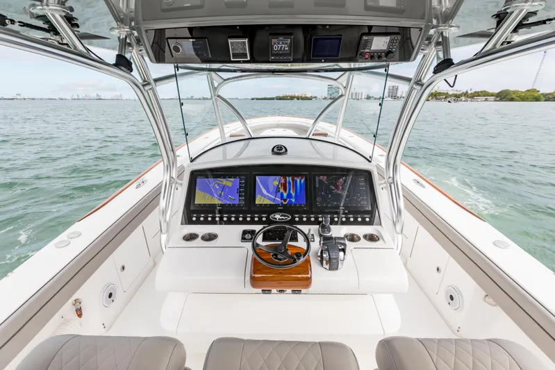 Bank Fees Yacht Photos Pics 2022 Valhalla Boatworks V-41 helm with advanced navigation displays on open water.