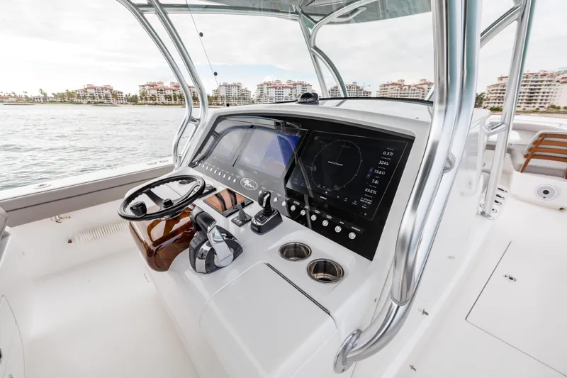 Bank Fees Yacht Photos Pics 2022 Valhalla Boatworks V-41 helm with modern controls and navigation display.