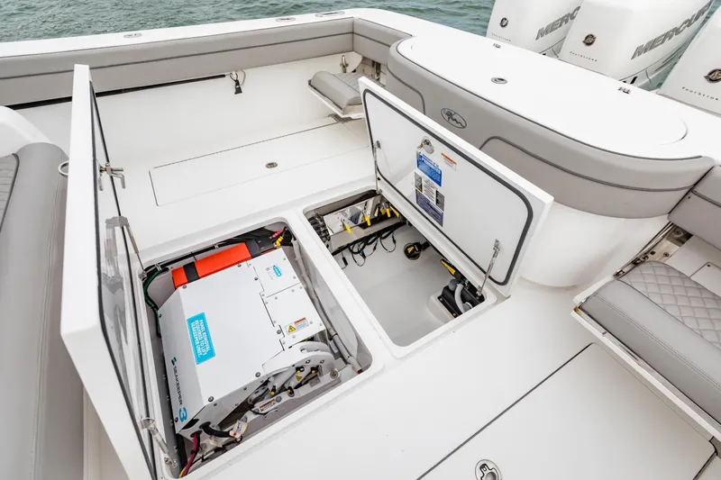 Bank Fees Yacht Photos Pics 2022 Valhalla Boatworks V-41 deck with open storage compartments and visible equipment.