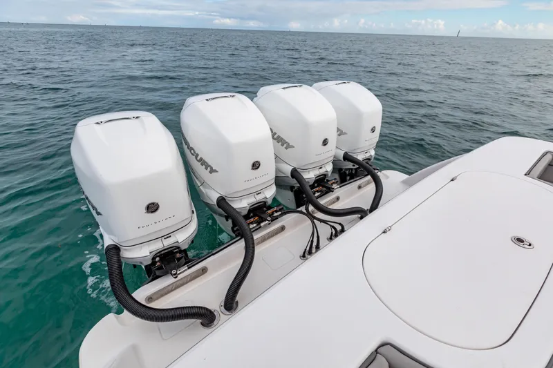 Bank Fees Yacht Photos Pics 2022 Valhalla Boatworks V-41 with four powerful Mercury outboard engines on open water.