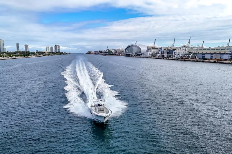 Bank Fees Yacht Photos Pics 2022 Valhalla Boatworks V-41 cruising in a scenic urban waterway.