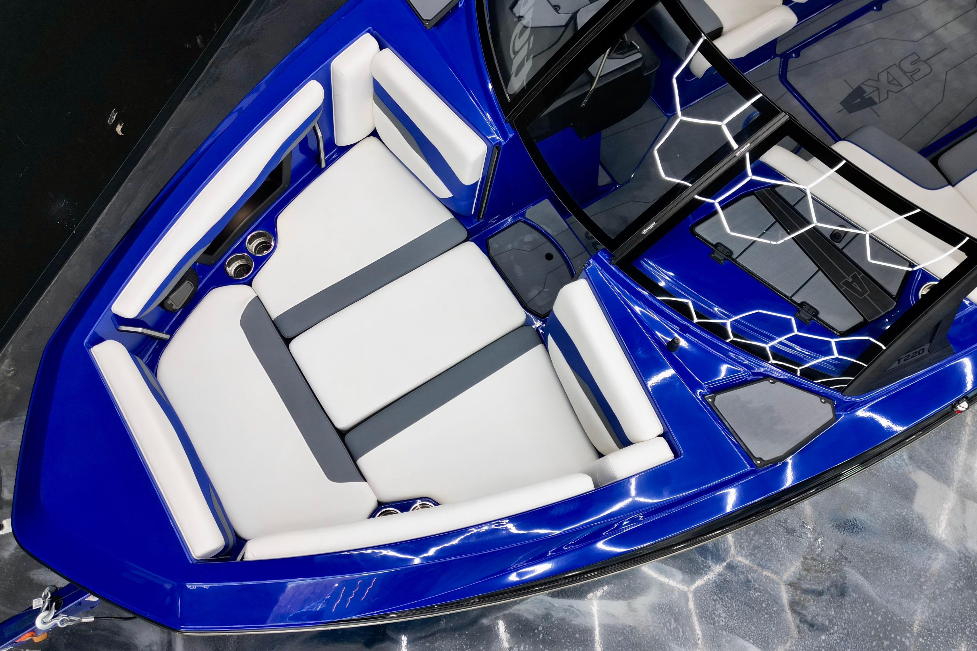 2025 Axis T220 boat interior with blue and white seating, modern design.