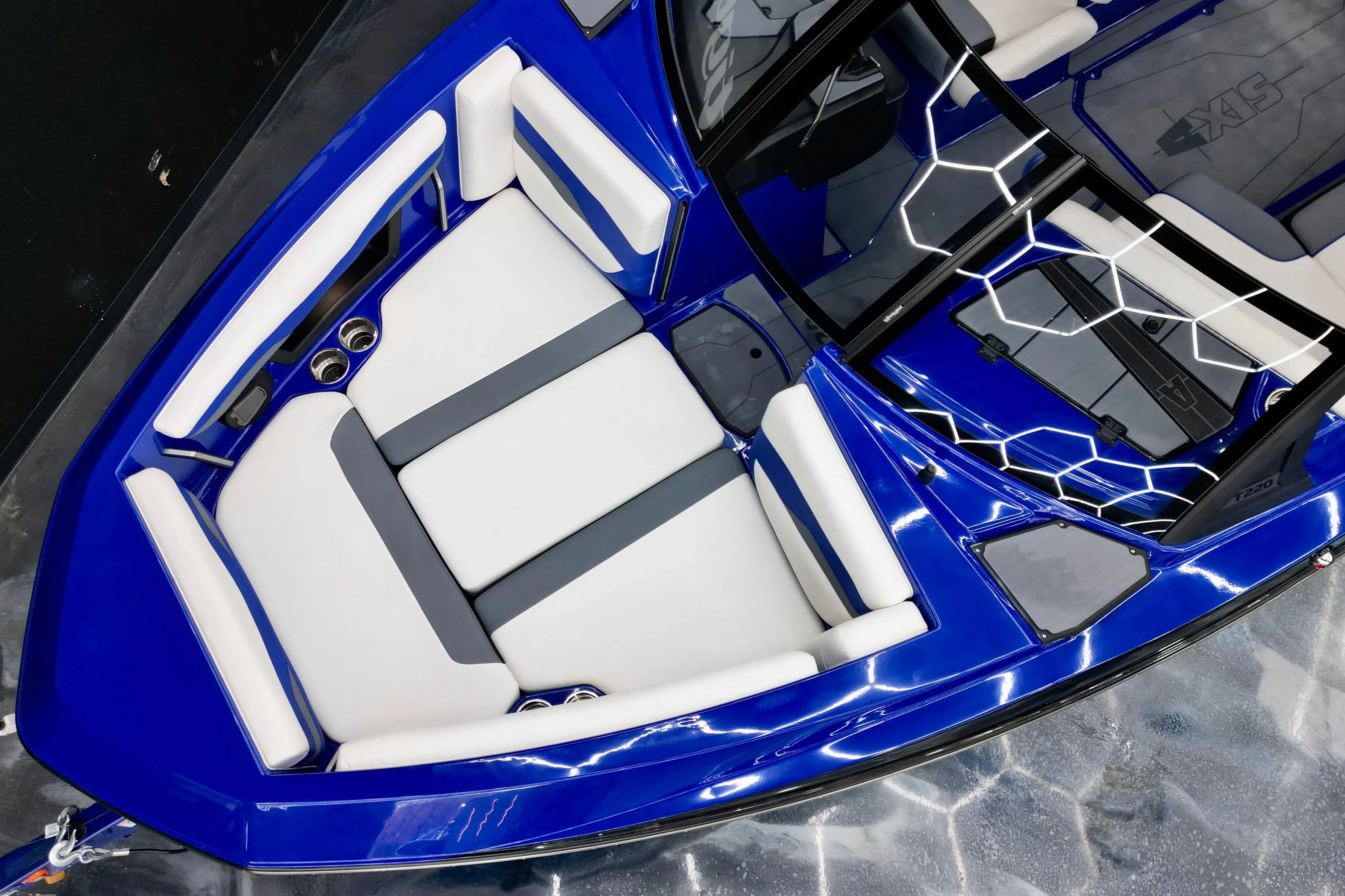2025 Axis T220 boat interior with blue and white seating, modern design.
