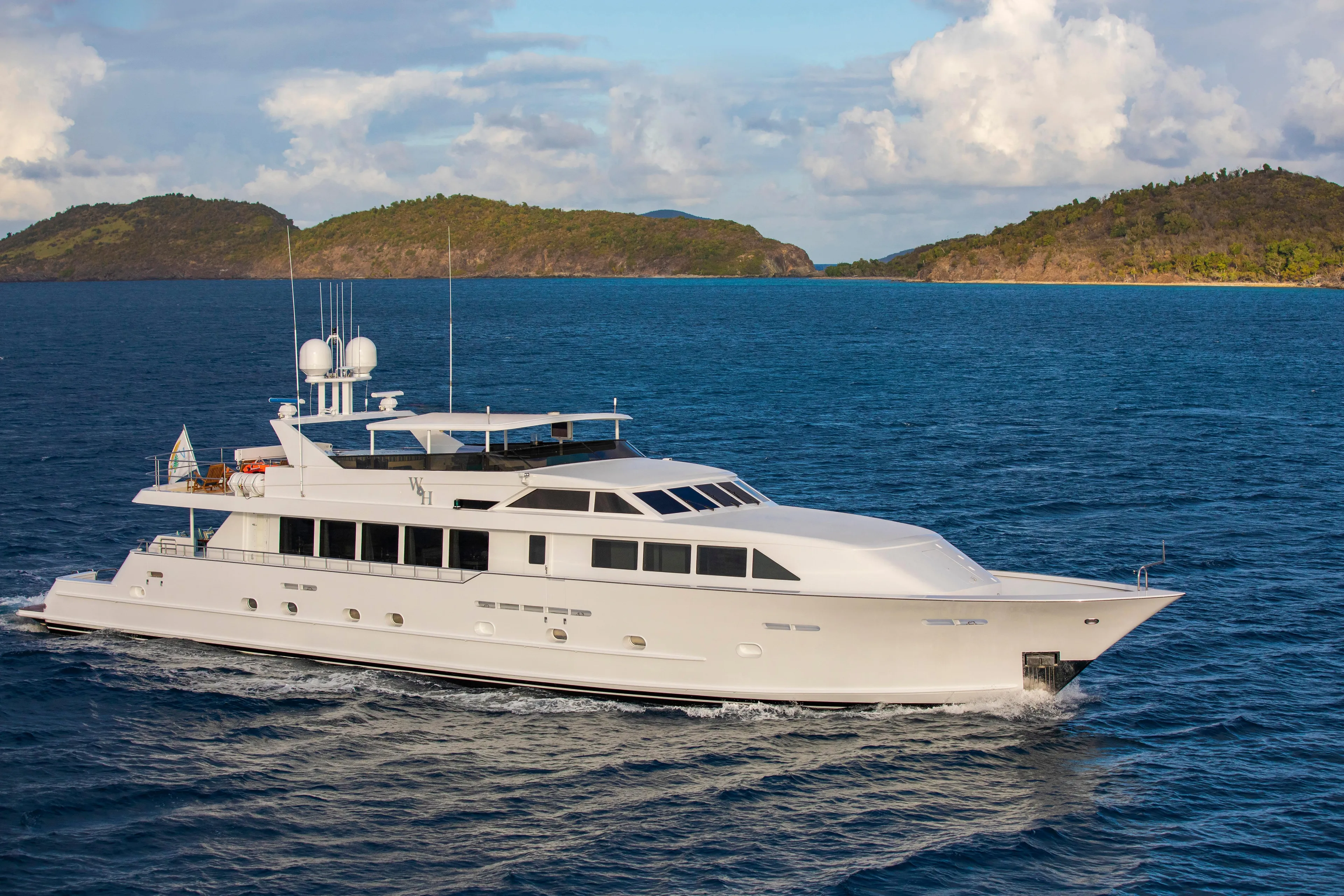  Yacht Photos Pics Luxury 1994 Broward Marine Raised Pilothouse yacht cruising on open sea.