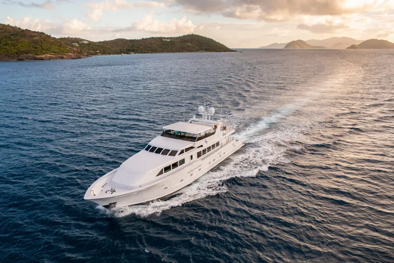  Yacht Photos Pics Luxury yacht cruising in open sea, Broward Marine Raised Pilothouse, 1994 model.