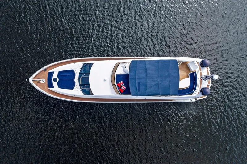 Persistence Yacht Photos Pics Aerial view of 2006 Sunseeker 75 Yacht on calm water.