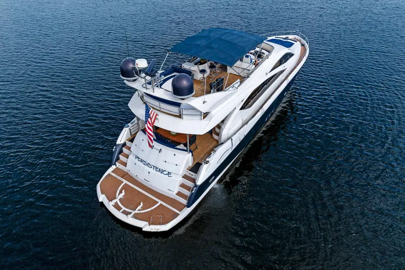 Persistence Yacht Photos Pics 2006 Sunseeker 75 Yacht on water, featuring spacious deck and elegant design.