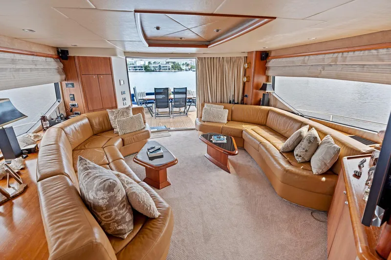 Persistence Yacht Photos Pics Luxurious interior of 2006 Sunseeker 75 Yacht with leather seating and waterfront view.