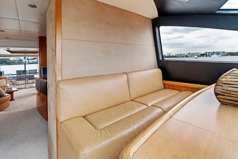 Persistence Yacht Photos Pics Luxurious interior of 2006 Sunseeker 75 Yacht with leather seating and scenic window view.