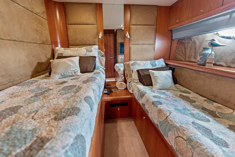 Persistence Yacht Photos Pics Luxurious twin cabin interior of 2006 Sunseeker 75 Yacht with elegant bedding and decor.