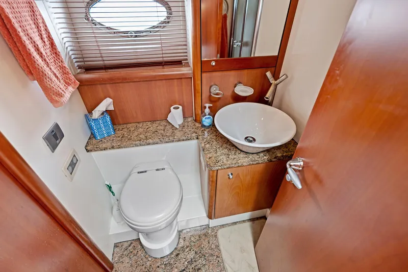 Persistence Yacht Photos Pics Luxurious bathroom in 2006 Sunseeker 75 Yacht with modern fixtures and granite countertop.