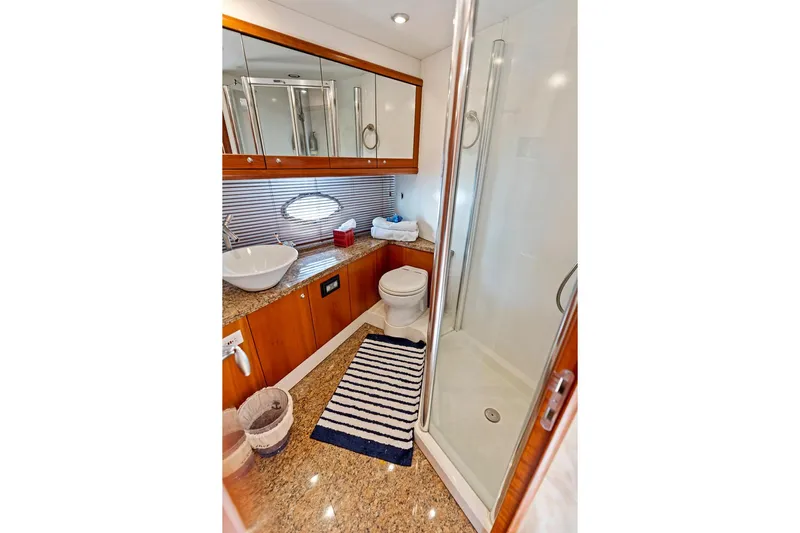 Persistence Yacht Photos Pics Luxurious bathroom in 2006 Sunseeker 75 Yacht with modern fixtures and elegant design.