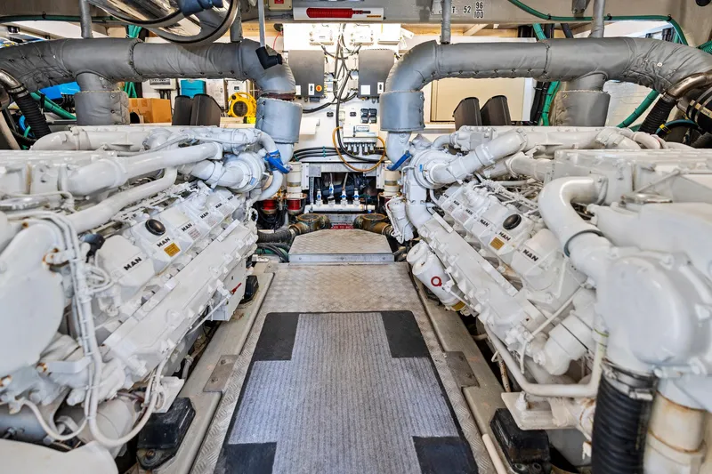 Persistence Yacht Photos Pics Engine room of a 2006 Sunseeker 75 Yacht, featuring dual MAN engines.
