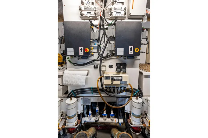 Persistence Yacht Photos Pics Engine room of a 2006 Sunseeker 75 Yacht, featuring control panels and wiring.