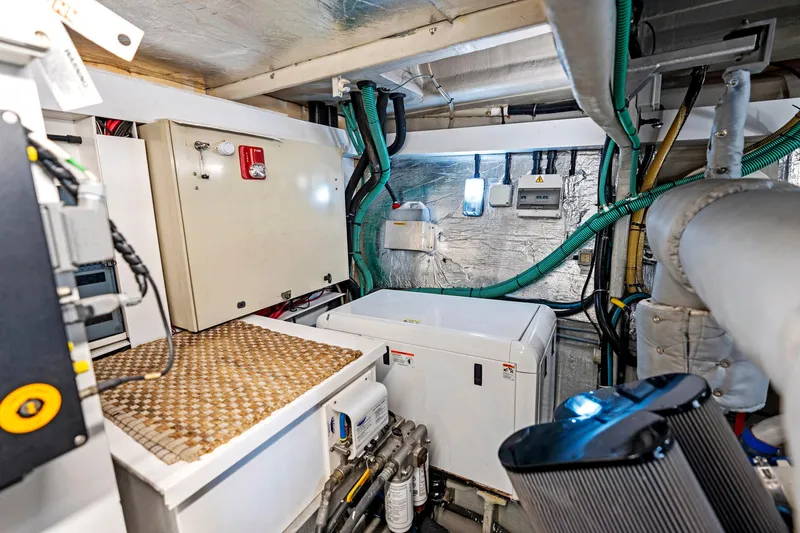 Persistence Yacht Photos Pics Engine room of 2006 Sunseeker 75 Yacht with electrical panels and wiring.