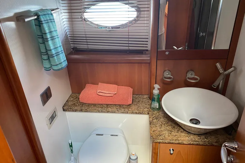 Persistence Yacht Photos Pics Luxurious bathroom in 2006 Sunseeker 75 Yacht with modern fixtures and elegant design.