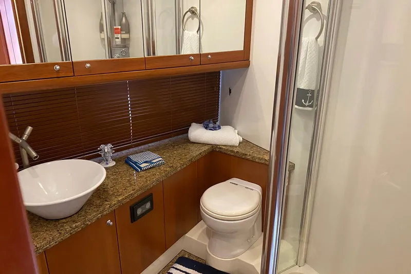 Persistence Yacht Photos Pics Luxurious bathroom in 2006 Sunseeker 75 Yacht with modern fixtures and elegant design.