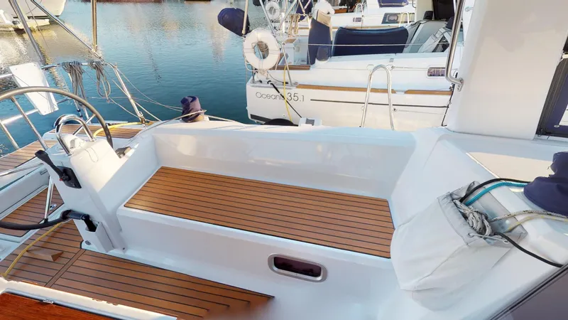 Wanderlust Yacht Photos Pics 2019 Beneteau Oceanis 38.1 sailboat with teak deck, docked at marina.