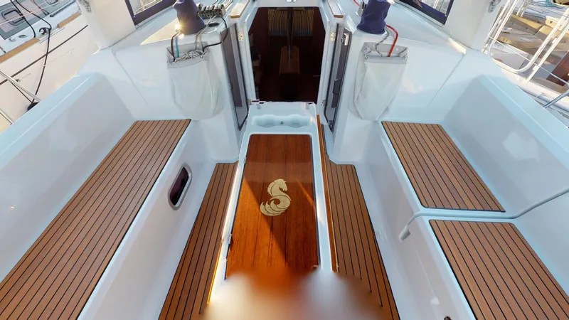 Wanderlust Yacht Photos Pics 2019 Beneteau Oceanis 38.1 yacht cockpit with teak flooring and seating.