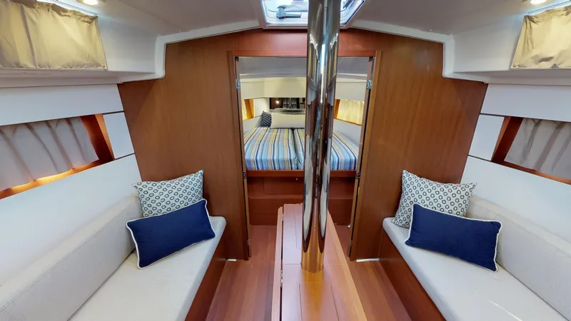 Wanderlust Yacht Photos Pics Interior of 2019 Beneteau Oceanis 38.1 yacht with cozy seating and elegant wood finish.